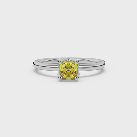 Yellow Asscher cut solitaire ring in gold featuring a floral-inspired four-prong basket setting with a 5.00 MM center gemstone
