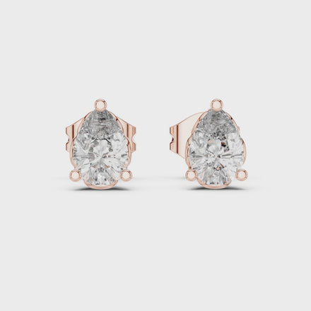 Pear cut solitaire diamond stud earrings in gold with lab grown diamonds
