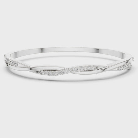 Twisted lab grown diamond bangle bracelet in yellow gold white gold and rose gold with modern crossover diamond design