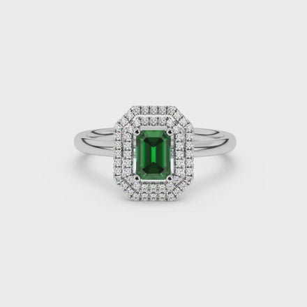 Emerald cut green gemstone double halo ring with octagonal diamond frame in gold