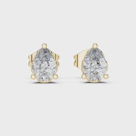 Pear cut solitaire diamond stud earrings in gold with lab grown diamonds