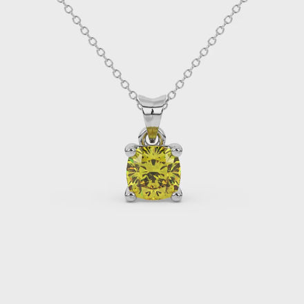 Yellow cushion cut gemstone solitaire pendant in gold featuring a refined four-prong basket setting