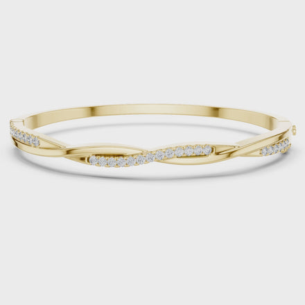 Twisted lab grown diamond bangle bracelet in yellow gold white gold and rose gold with modern crossover diamond design