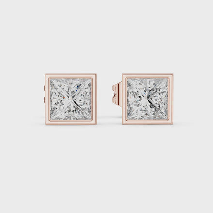 Princess cut solitaire diamond stud earrings in gold with bezel setting and lab grown diamonds by Signora Jewels