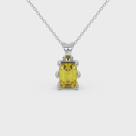 Emerald cut yellow gemstone solitaire pendant in gold with six prong setting