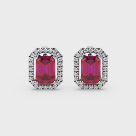 Emerald cut red gemstone halo stud earrings with round diamond accents
