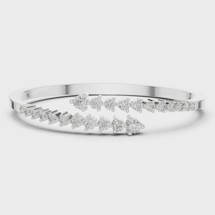Graduated round lab grown diamond open cuff bracelet with flowing diamond design in yellow white and rose gold
