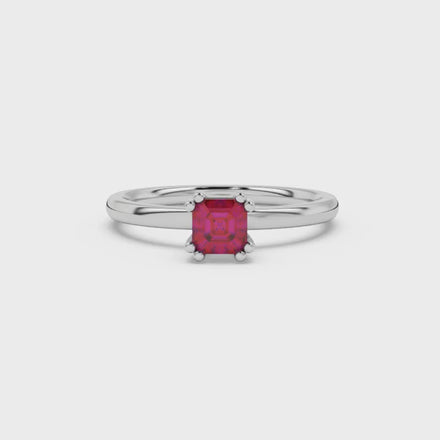 Red Asscher cut gemstone solitaire ring in gold featuring a refined six-prong basket setting