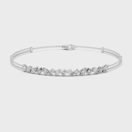 Contemporary multi shape lab grown diamond chain bracelet with pear oval marquise and emerald cut diamonds in yellow white and rose gold