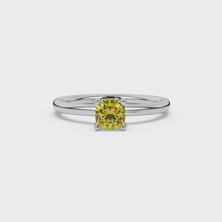 Yellow cushion cut solitaire gemstone ring in yellow gold four-prong setting