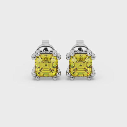 Yellow Asscher cut stud earrings in gold featuring a crown-inspired eight-prong setting and push back closure