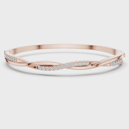 Twisted lab grown diamond bangle bracelet in yellow gold white gold and rose gold with modern crossover diamond design