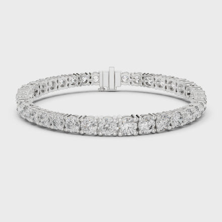 Graduated lab grown diamond tennis bracelet with varying size round diamonds in yellow white and rose gold