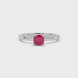 Red cushion cut gemstone solitaire ring in gold featuring a refined four-prong cathedral basket setting