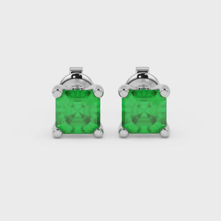 Hidden halo Asscher cut solitaire stud earrings featuring 5.00 MM gemstones in a four-prong gold setting