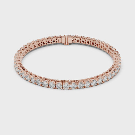 Classic round diamond tennis bracelet available in yellow gold white gold and rose gold with 49 brilliant diamonds in elegant collet setting design