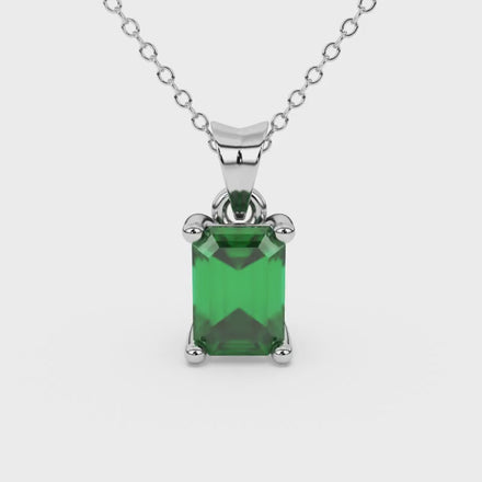 Emerald cut green gemstone solitaire pendant in rose gold four prong setting