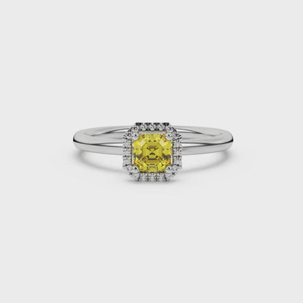 Asscher cut halo gemstone ring in gold featuring a 5.00 MM center gemstone surrounded by round diamond accents