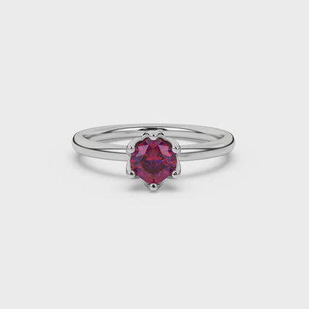 Red cushion cut floral solitaire ring in rose gold with six prong flower setting