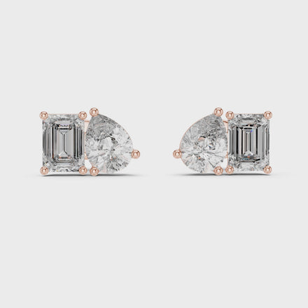 Pear and emerald cut diamond stud earrings in modern luxury design