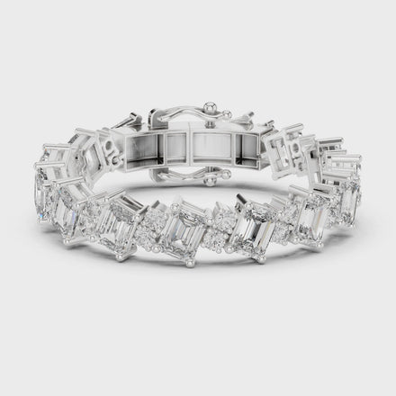 Luxury emerald cut diamond tennis bracelet in gold with round accent diamonds by Signora Jewels