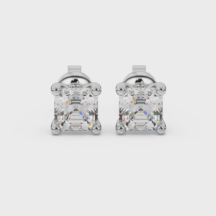 Hidden halo Asscher cut solitaire stud earrings featuring 5.00 MM gemstones in a four-prong gold setting